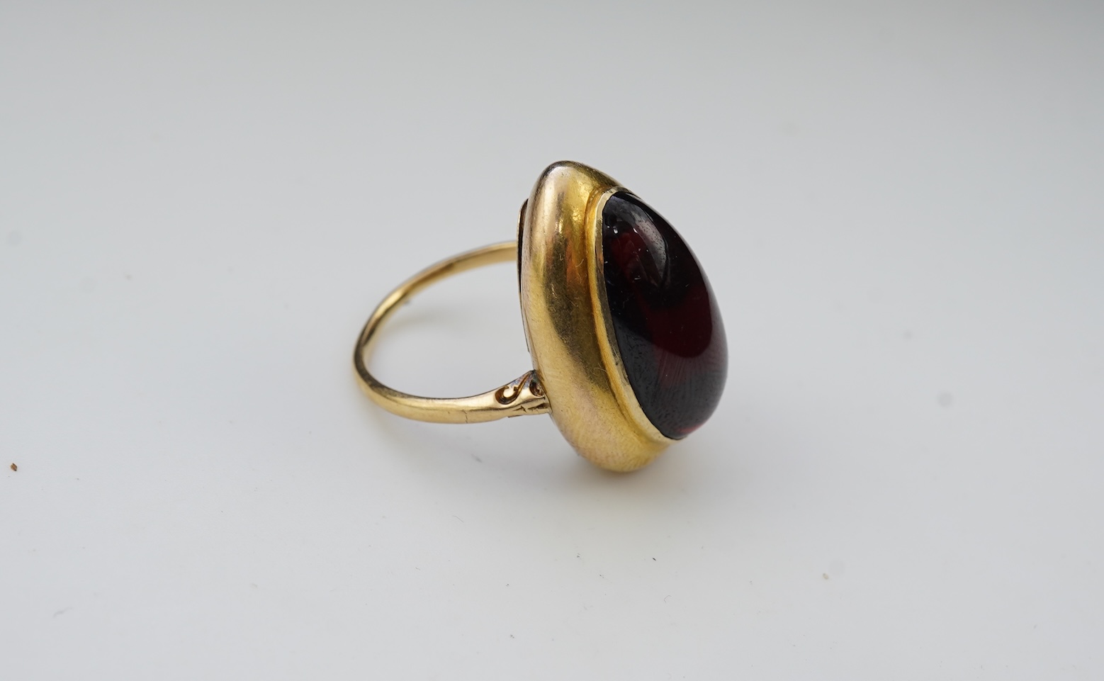 An unusual garnet locket ring, late 19th century composite